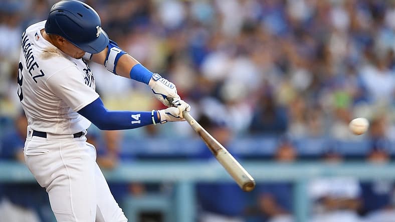 Aug 12, 2023; Los Angeles, California, USA; Los Angeles Dodgers shortstop Enrique Hernandez (8) doubles against the Colorado Rockies during the second inning at Dodger Stadium. Mandatory Credit: Jonathan Hui-USA TODAY Sports