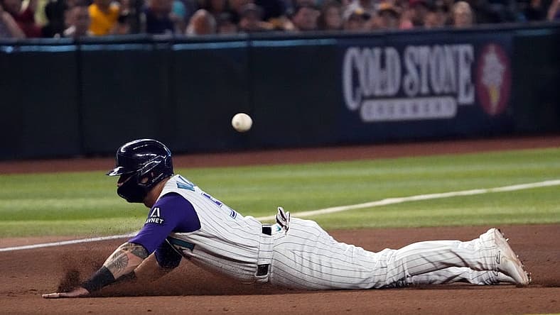 Aug 13, 2023; Phoenix, Arizona, USA; Arizona Diamondbacks first baseman Christian Walker (53) slides into third base against the San Diego Padres during the eighth inning at Chase Field. Mandatory Credit: Joe Camporeale-USA TODAY Sports