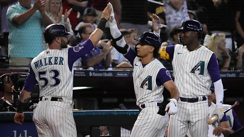 Aug 13, 2023; Phoenix, Arizona, USA; Arizona Diamondbacks first baseman Christian Walker (53) and Arizona Diamondbacks center fielder Alek Thomas (5) an Arizona Diamondbacks shortstop Geraldo Perdomo (2) celebrate during the eighth inning against the San Diego Padres at Chase Field. Mandatory Credit: Joe Camporeale-USA TODAY Sports