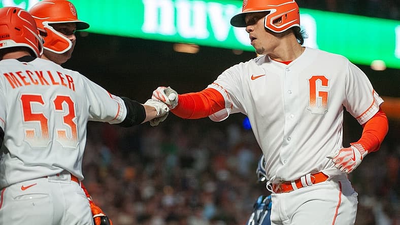 Aug 15, 2023; San Francisco, California, USA; San Francisco Giants third baseman Wilmer Flores (41) celebrates with right fielder Wade Meckler (53) after hitting a home run during the sixth inning against the Tampa Bay Rays at Oracle Park. Mandatory Credit: Ed Szczepanski-USA TODAY Sports