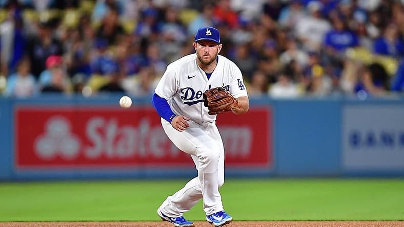 Aug 15, 2023; Los Angeles, California, USA; Los Angeles Dodgers third baseman Max Muncy (13) fields the ground ball of Milwaukee Brewers designated hitter Mark Canha (21) during the fifth inning at Dodger Stadium. Mandatory Credit: Gary A. Vasquez-USA TODAY Sports