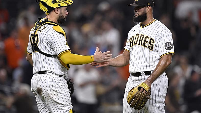 Aug 15, 2023; San Diego, California, USA; San Diego Padres catcher Gary Sanchez (99) and relief pitcher Luis Garcia (right) celebrate after defeating the Baltimore Orioles at Petco Park. Mandatory Credit: Orlando Ramirez-USA TODAY Sports