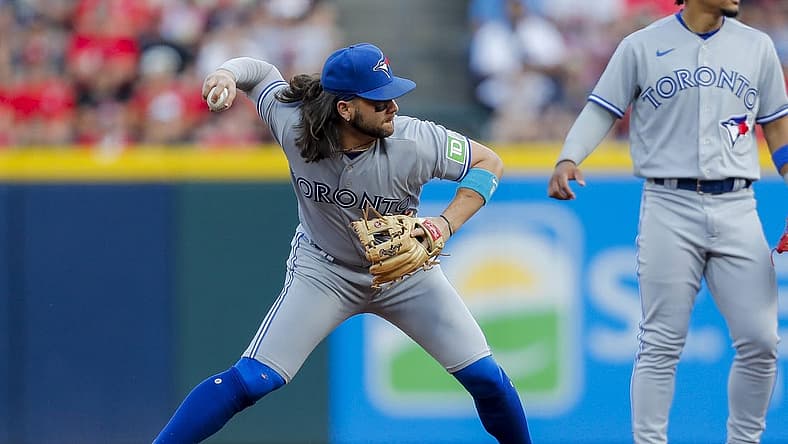 Aug 19, 2023; Cincinnati, Ohio, USA; Toronto Blue Jays shortstop Bo Bichette (11) throws to first to get the out in the third inning at Great American Ball Park. Mandatory Credit: Katie Stratman-USA TODAY Sports