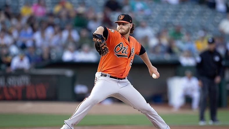 Aug 19, 2023; Oakland, California, USA; Baltimore Orioles starting pitcher Cole Irvin (19) pitches against the Oakland Athletics during the second inning at Oakland-Alameda County Coliseum. Mandatory Credit: D. Ross Cameron-USA TODAY Sports