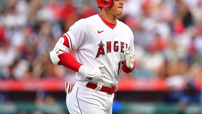 Aug 19, 2023; Anaheim, California, USA; Los Angeles Angels designated hitter Shohei Ohtani (17) returns to the dugout after hitting a pop fly ball during the first inning at Angel Stadium. Mandatory Credit: Gary A. Vasquez-USA TODAY Sports