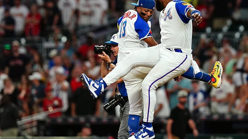 Aug 19, 2023; Cumberland, Georgia, USA; Atlanta Braves right fielder Ronald Acuna Jr. (13) and Atlanta Braves designated hitter Marcell Ozuna (20) celebrate their victory against the San Francisco Giants at Truist Park. Mandatory Credit: John David Mercer-USA TODAY Sports