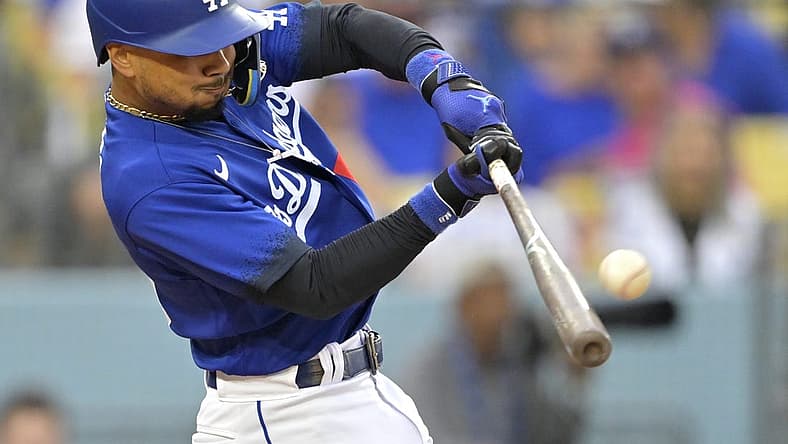 Aug 19, 2023; Los Angeles, California, USA; Los Angeles Dodgers right fielder Mookie Betts (50) hits a solo home run in the third inning against the Miami Marlins at Dodger Stadium. Mandatory Credit: Jayne Kamin-Oncea-USA TODAY Sports