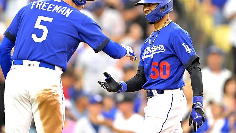 Aug 19, 2023; Los Angeles, California, USA; Los Angeles Dodgers right fielder Mookie Betts (50) is congratulated by first baseman Freddie Freeman (5) after hitting a solo home run in the third inning against the Miami Marlins at Dodger Stadium. Mandatory Credit: Jayne Kamin-Oncea-USA TODAY Sports