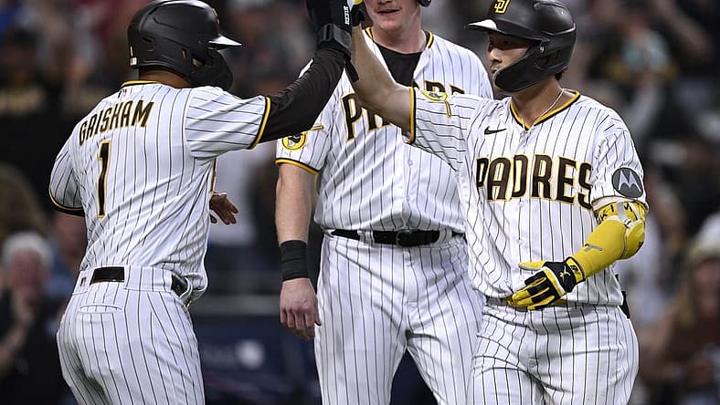 Aug 21, 2023; San Diego, California, USA; San Diego Padres second baseman Ha-seong Kim (7) is congratulated by center fielder Trent Grisham (1) after hitting a grand slam home run against the Miami Marlins during the second inning at Petco Park. Mandatory Credit: Orlando Ramirez-USA TODAY Sports