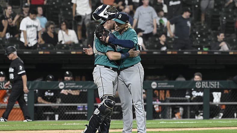 Aug 21, 2023; Chicago, Illinois, USA; Seattle Mariners catcher Brian O'Keefe (64) and Seattle Mariners relief pitcher Darren McCaughan (26) after the game against the Chicago White Sox at Guaranteed Rate Field. Mandatory Credit: Matt Marton-USA TODAY Sports