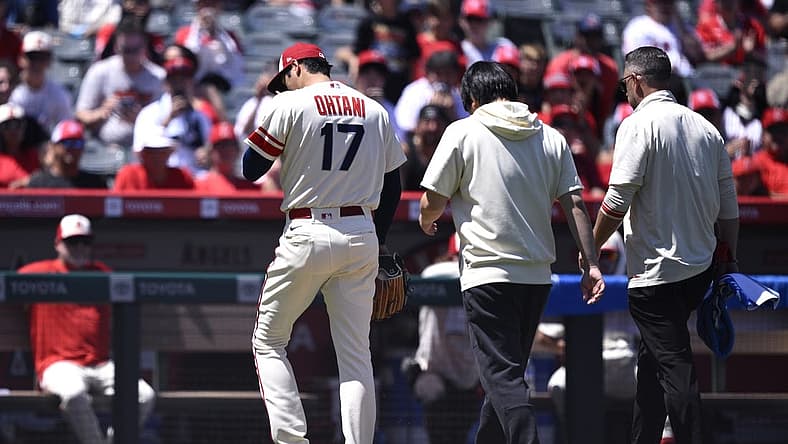 Aug 23, 2023; Anaheim, California, USA; Los Angeles Angels starting pitcher Shohei Ohtani (17) leaves the field during the second inning against the Cincinnati Reds at Angel Stadium. Mandatory Credit: Orlando Ramirez-USA TODAY Sports