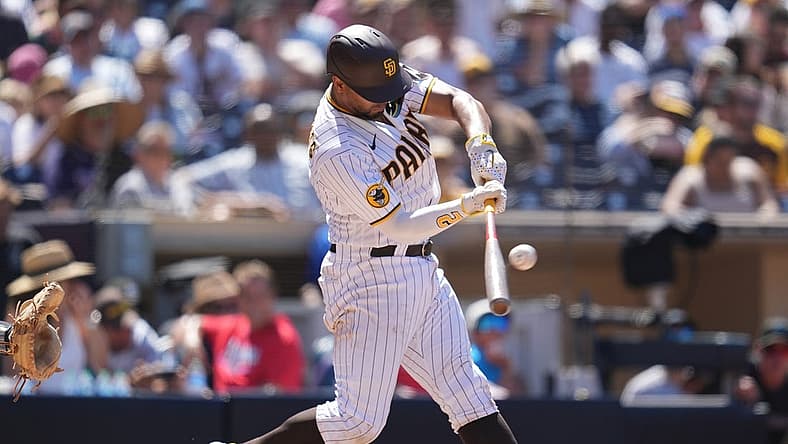 Aug 23, 2023; San Diego, California, USA; San Diego Padres shortstop Xander Bogaerts (2) hits a two run home run against the Miami Marlins during the sixth inning at Petco Park. Mandatory Credit: Ray Acevedo-USA TODAY Sports