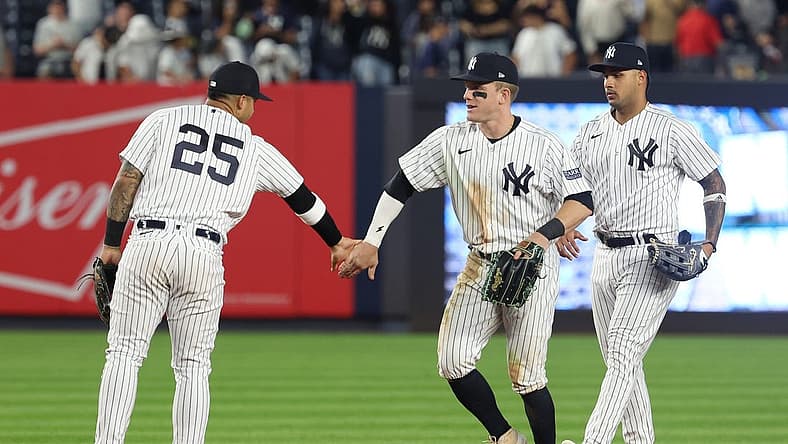 Aug 23, 2023; Bronx, New York, USA; New York Yankees center fielder Harrison Bader (22) celebrates with second baseman Gleyber Torres (25) and center fielder Everson Pereira (80) after defeating the Washington Nationals at Yankee Stadium. Mandatory Credit: Vincent Carchietta-USA TODAY Sports