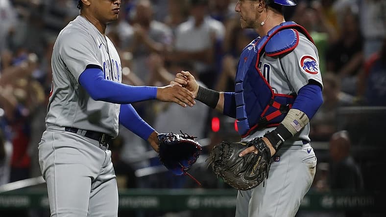 Aug 24, 2023; Pittsburgh, Pennsylvania, USA; Chicago Cubs relief pitcher Adbert Alzolay (73) and catcher Yan Gomes (15) shake hands after defeating the Pittsburgh Pirates at PNC Park. Mandatory Credit: Charles LeClaire-USA TODAY Sports