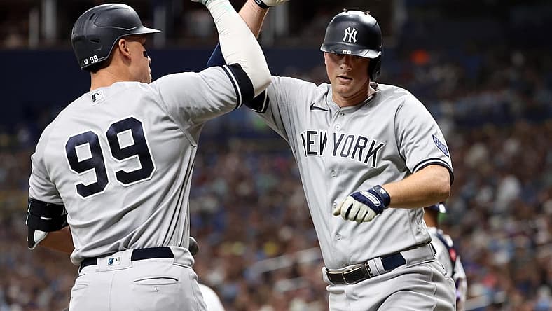 Aug 25, 2023; St. Petersburg, Florida, USA; New York Yankees third baseman DJ LeMahieu (26) celebrates with right fielder Aaron Judge (99) after he hit a home run against the Tampa Bay Rays during the fifth inning at Tropicana Field. Mandatory Credit: Kim Klement Neitzel-USA TODAY Sports