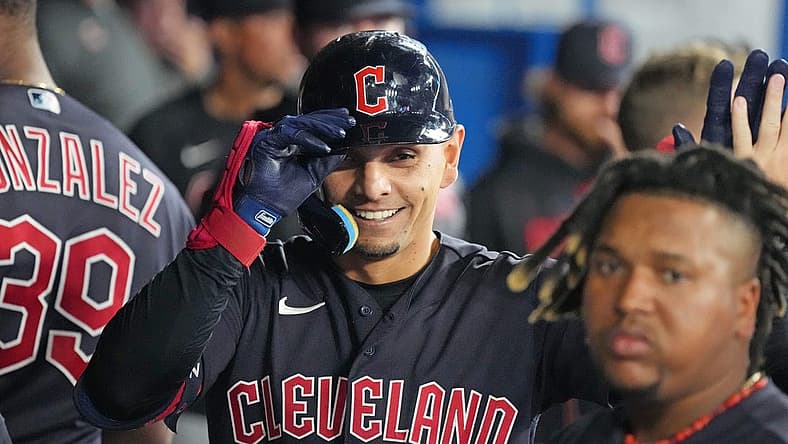 Aug 25, 2023; Toronto, Ontario, CAN; Cleveland Guardians second baseman Andres Gimenez (0) celebrates in the dugout after hitting a home run against the Toronto Blue Jays during the eighth inning at Rogers Centre. Mandatory Credit: Nick Turchiaro-USA TODAY Sports