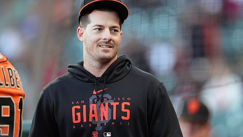 Aug 25, 2023; San Francisco, California, USA; San Francisco Giants outfielder Mike Yastrzemski stands in the dugout before the game against the Atlanta Braves at Oracle Park. Mandatory Credit: Darren Yamashita-USA TODAY Sports