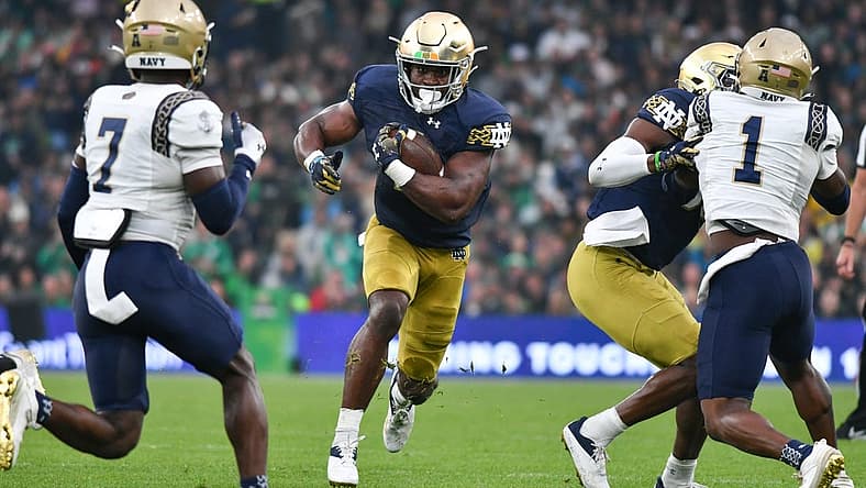 Aug 26, 2023; Dublin, IRL; Notre Dame Fighting Irish running back Audric Estime (7) runs the ball in the first quarter against the Navy Midshipmen at Aviva Stadium. Mandatory Credit: Matt Cashore-USA TODAY Sports