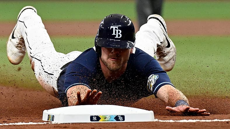Aug 26, 2023; St. Petersburg, Florida, USA; Tampa Bay Rays center fielder Luke Raley (55) slides into third base against the New York Yankees in the second inning at Tropicana Field. Mandatory Credit: Jonathan Dyer-USA TODAY Sports