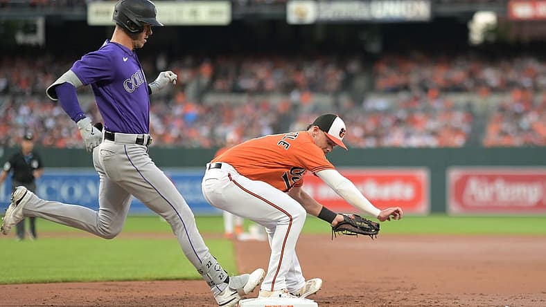 Aug 26, 2023; Baltimore, Maryland, USA; Baltimore Orioles first baseman Ryan Mountcastle (6) secures the ball for the forecourt of Colorado Rockies right fielder Nolan Jones (22) during the second inning at Oriole Park at Camden Yards. Mandatory Credit: Tommy Gilligan-USA TODAY Sports