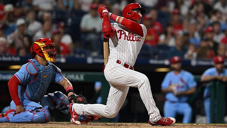 Aug 26, 2023; Philadelphia, Pennsylvania, USA; Philadelphia Phillies second baseman Bryson Stott (5) hits a solo home run to center field during the fourth inning against the St. Louis Cardinals at Citizens Bank Park. Mandatory Credit: John Geliebter-USA TODAY Sports