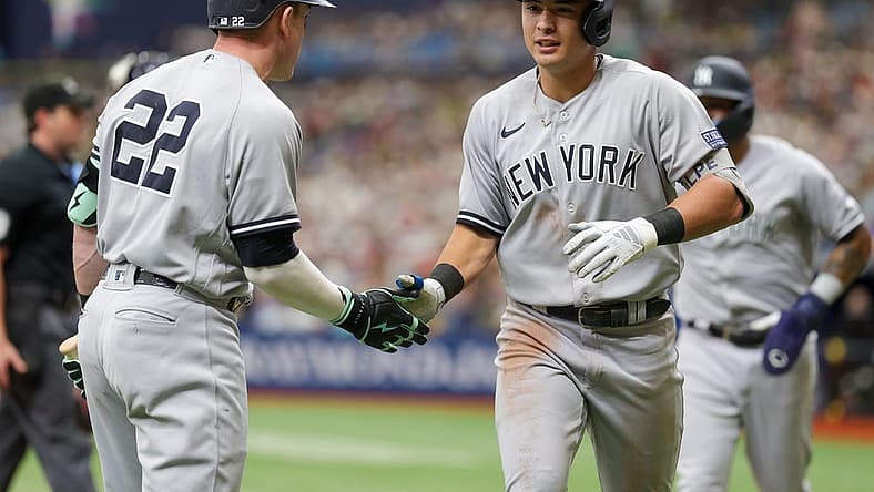Aug 27, 2023; St. Petersburg, Florida, USA; New York Yankees center fielder Harrison Bader (22) congratulates shortstop Anthony Volpe (11) after hitting a two run home run against the Tampa Bay Rays in the fourth inning at Tropicana Field. Mandatory Credit: Nathan Ray Seebeck-USA TODAY Sports