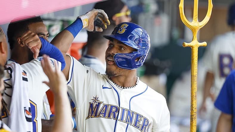 Aug 27, 2023; Seattle, Washington, USA; Seattle Mariners center fielder Julio Rodriguez (44) celebrates in the dugout after hitting a two-run home run against the Kansas City Royals during the fifth inning at T-Mobile Park. Mandatory Credit: Joe Nicholson-USA TODAY Sports
