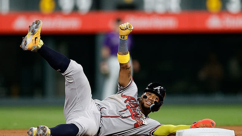 Aug 28, 2023; Denver, Colorado, USA; Atlanta Braves right fielder Ronald Acuna Jr. (13) reacts after stealing second in the seventh inning against the Colorado Rockies at Coors Field. Mandatory Credit: Isaiah J. Downing-USA TODAY Sports