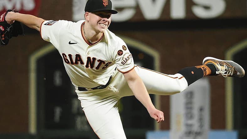 Aug 28, 2023; San Francisco, California, USA; San Francisco Giants starting pitcher Kyle Harrison (45) pitches the ball against the Cincinnati Reds during the seventh inning at Oracle Park. Mandatory Credit: Kelley L Cox-USA TODAY Sports