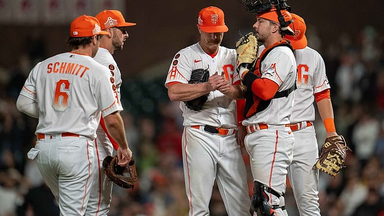Aug 29, 2023; San Francisco, California, USA; San Francisco Giants starting pitcher Alex Cobb (38) talks it over with San Francisco Giants catcher Patrick Bailey (14) and teammates during the ninth inning against the Cincinnati Reds at Oracle Park. Mandatory Credit: Neville E. Guard-USA TODAY Sports