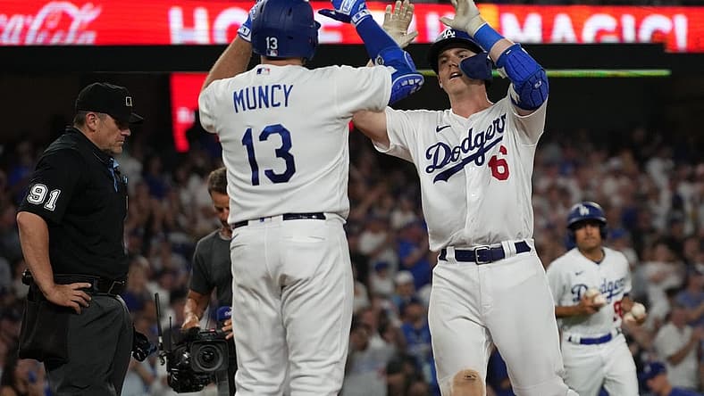 Aug 29, 2023; Los Angeles, California, USA; Los Angeles Dodgers catcher Will Smith (16) celebrates with third baseman Max Muncy (13) after hitting a home run in the sixth inning against the Arizona Diamondbacks at Dodger Stadium. Mandatory Credit: Kirby Lee-USA TODAY Sports