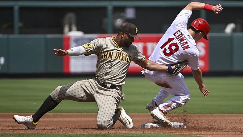 Aug 30, 2023; St. Louis, Missouri, USA; St. Louis Cardinals center fielder Tommy Edman (19) slides safely past the tag of San Diego Padres shortstop Xander Bogaerts (2) for a stolen base during the first inning at Busch Stadium. Mandatory Credit: Jeff Curry-USA TODAY Sports