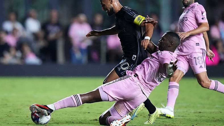 Aug 30, 2023; Fort Lauderdale, Florida, USA; Inter Miami defender Kamal Miller (31) slide tackles Nashville SC midfielder Hany Mukhtar (10) during the second half at DRV PNK Stadium. Mandatory Credit: Rich Storry-USA TODAY Sports