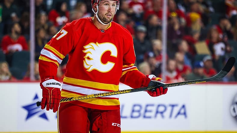 Mar 28, 2023; Calgary, Alberta, CAN; Calgary Flames left wing Nick Ritchie (27) against the Los Angeles Kings during the first period at Scotiabank Saddledome. Mandatory Credit: Sergei Belski-USA TODAY Sports