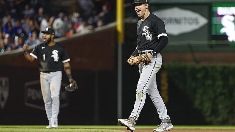 Aug 15, 2023; Chicago, Illinois, USA; Chicago White Sox second baseman Zach Remillard (28) celebrates after tagging out Chicago Cubs second baseman Nico Hoerner at second base during the seventh inning at Wrigley Field. Mandatory Credit: Kamil Krzaczynski-USA TODAY Sports