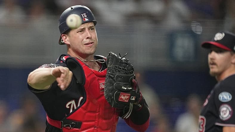 Aug 25, 2023; Miami, Florida, USA; Washington Nationals catcher Riley Adams (15) throws out Miami Marlins right fielder Jesus Sanchez (7) in the ninth inning at loanDepot Park. Mandatory Credit: Jim Rassol-USA TODAY Sports