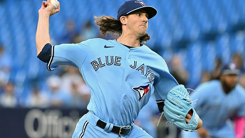 Aug 28, 2023; Toronto, Ontario, CAN; Toronto Blue Jays starting pitcher Kevin Gausman (34) delivers a pitch against the Washington National in the first inning at Rogers Centre. Mandatory Credit: Dan Hamilton-USA TODAY Sports