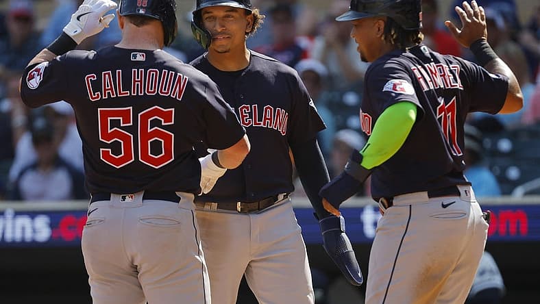 Aug 30, 2023; Minneapolis, Minnesota, USA; Cleveland Guardians first baseman Kole Calhoun (56) celebrates with catcher Bo Naylor (23) and third baseman Jose Ramirez (11) after hitting a three-run home run against the Minnesota Twins in the tenth inning at Target Field. Mandatory Credit: Bruce Kluckhohn-USA TODAY Sports