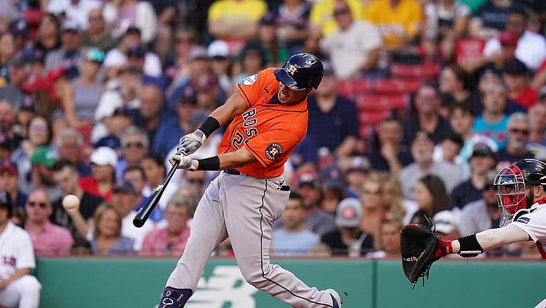 Aug 30, 2023; Boston, Massachusetts, USA; Houston Astros designated hitter Michael Brantley (23) hits a single to right field to drive in two runs against the Boston Red Sox in the third inning at Fenway Park. Mandatory Credit: David Butler II-USA TODAY Sports