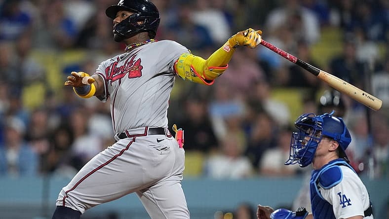 Aug 31, 2023; Los Angeles, California, USA; Atlanta Braves right fielder Ronald Acuna Jr. (13) hits a grand slam home run in the second inning against the Los Angeles Dodger at Dodger Stadium. Mandatory Credit: Kirby Lee-USA TODAY Sports