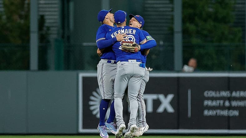 Sep 1, 2023; Denver, Colorado, USA; Toronto Blue Jays center fielder Kevin Kiermaier (39) and right fielder George Springer (4) and left fielder Daulton Varsho (25) celebrate after the game against the Colorado Rockies at Coors Field. Mandatory Credit: Isaiah J. Downing-USA TODAY Sports