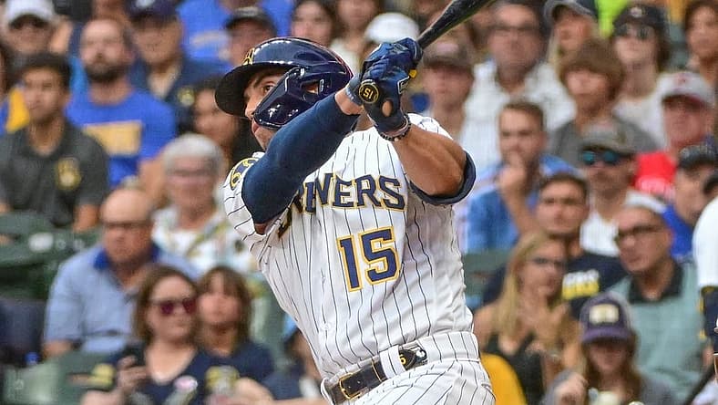 Sep 2, 2023; Milwaukee, Wisconsin, USA; Milwaukee Brewers right fielder Tyrone Taylor (15) hits a double to drive in a run in the second inning against the Philadelphia Phillies at American Family Field. Mandatory Credit: Benny Sieu-USA TODAY Sports