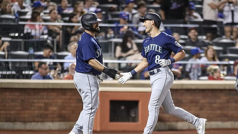 Sep 2, 2023; New York City, New York, USA; Seattle Mariners pinch hitter Dominic Canzone (8) is greeted by Seattle Mariners pinch runner Mike Ford (20) after hitting a two run home run in the sixth inning against the New York Mets at Citi Field. Mandatory Credit: Wendell Cruz-USA TODAY Sports