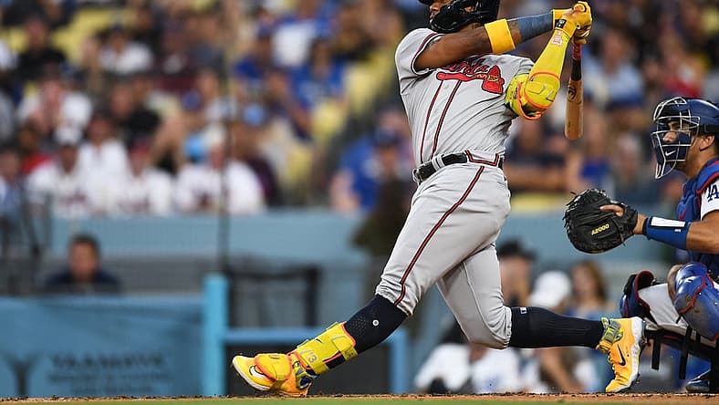 Sep 2, 2023; Los Angeles, California, USA; Atlanta Braves right fielder Ronald Acuna Jr. (13) hits a home run against the Los Angeles Dodgers during the third inning at Dodger Stadium. Mandatory Credit: Jonathan Hui-USA TODAY Sports
