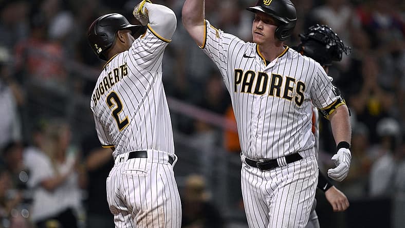 Sep 2, 2023; San Diego, California, USA; San Diego Padres first baseman Garrett Cooper (right) is congratulated by shortstop Xander Bogaerts (2) after hitting a three-run home run against the San Francisco Giants during the sixth inning at Petco Park. Mandatory Credit: Orlando Ramirez-USA TODAY Sports