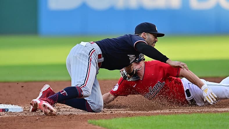 Sep 5, 2023; Cleveland, Ohio, USA; Cleveland Guardians center fielder Myles Straw (7) is caught stealing by Minnesota Twins shortstop Carlos Correa (4) during the third inning at Progressive Field. Mandatory Credit: Ken Blaze-USA TODAY Sports