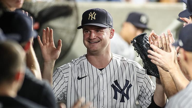 Sep 6, 2023; Bronx, New York, USA; New York Yankees starting pitcher Clarke Schmidt (36) is greeted in the dugout after being taken out in the seventh inning against the Detroit Tigers at Yankee Stadium. Mandatory Credit: Wendell Cruz-USA TODAY Sports