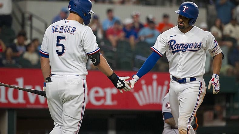 Sep 6, 2023; Arlington, Texas, USA; Texas Rangers shortstop Corey Seager (5) and second baseman Marcus Semien (2) celebrate after Semien hits a home run against the Houston Astros at Globe Life Field. Mandatory Credit: Jerome Miron-USA TODAY Sports