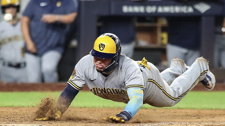 Sep 8, 2023; Bronx, New York, USA; Milwaukee Brewers catcher William Contreras (24) slides safely at home in the seventh inning against the New York Yankees at Yankee Stadium. Mandatory Credit: Wendell Cruz-USA TODAY Sports
