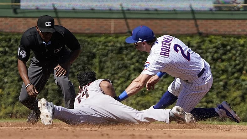 Sep 9, 2023; Chicago, Illinois, USA; Arizona Diamondbacks catcher Gabriel Moreno (14) steals second base as Chicago Cubs second baseman Nico Hoerner (2) makes a late tag during the third inning at Wrigley Field. Mandatory Credit: David Banks-USA TODAY Sports